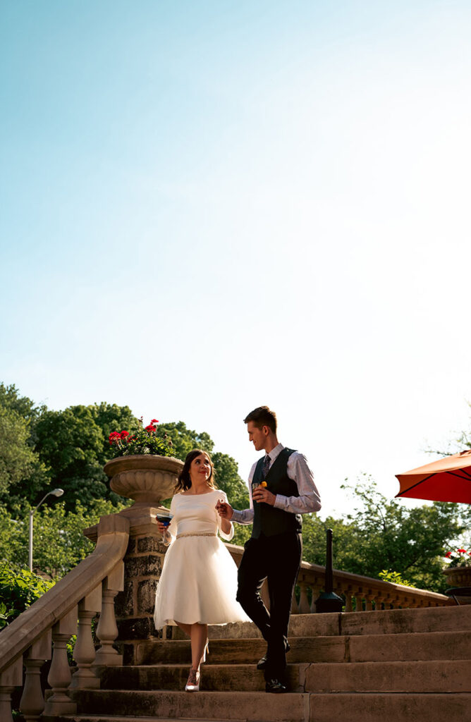 Bride and Groom outside of Mansion on fifth