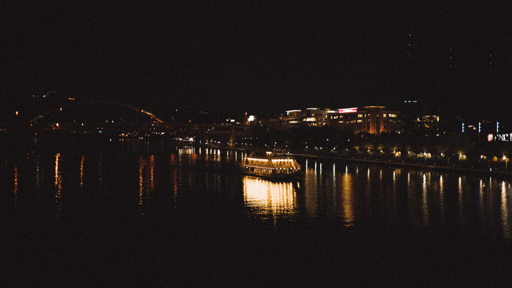 The Gateway Clipper at night and in the Ohio River. 