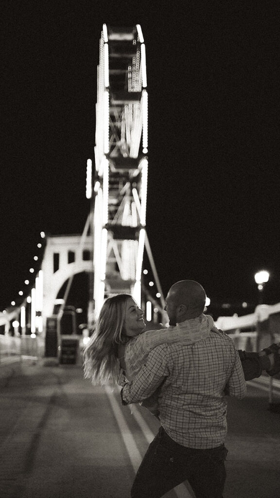 Couple enjoying Ferris wheel ride at Pittsburgh Oktoberfest fall photo session