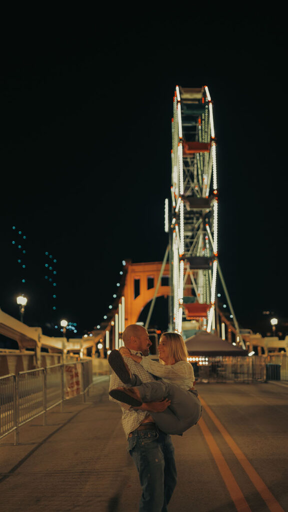 A romantic Ferris wheel ride captured during a fall couple session at Oktoberfest in Pittsburgh.
