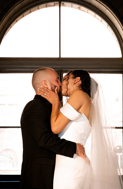 Bride and Groom kiss at their Intimate Wedding Ceremony