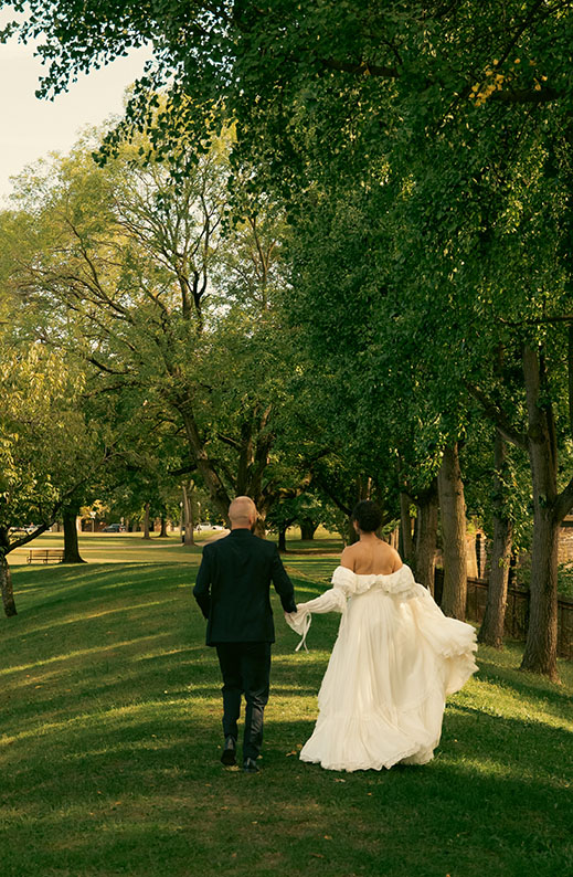 Bride and Groom Running off at Romantic Wedding at Allegheny Common's Park