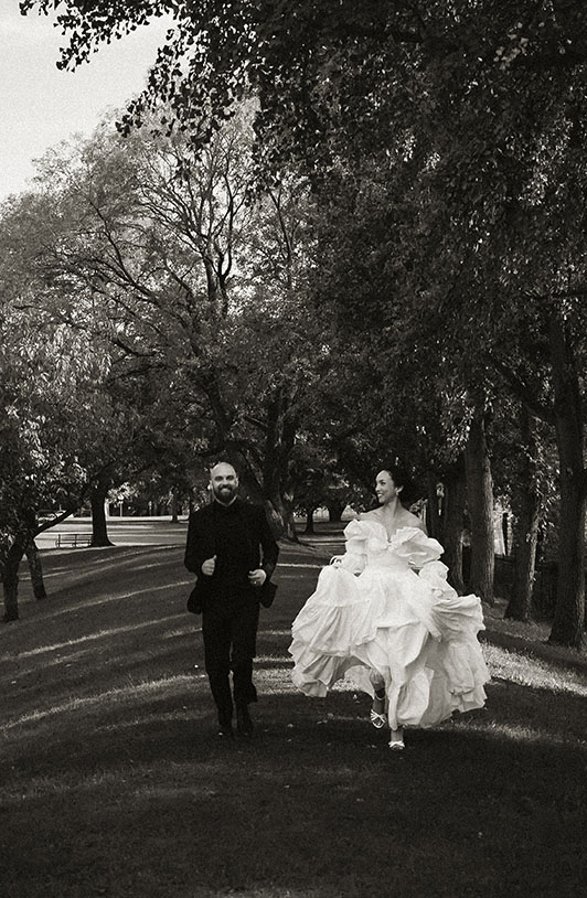 Bride and Groom Running after their wedding at Allegheny Common's Park