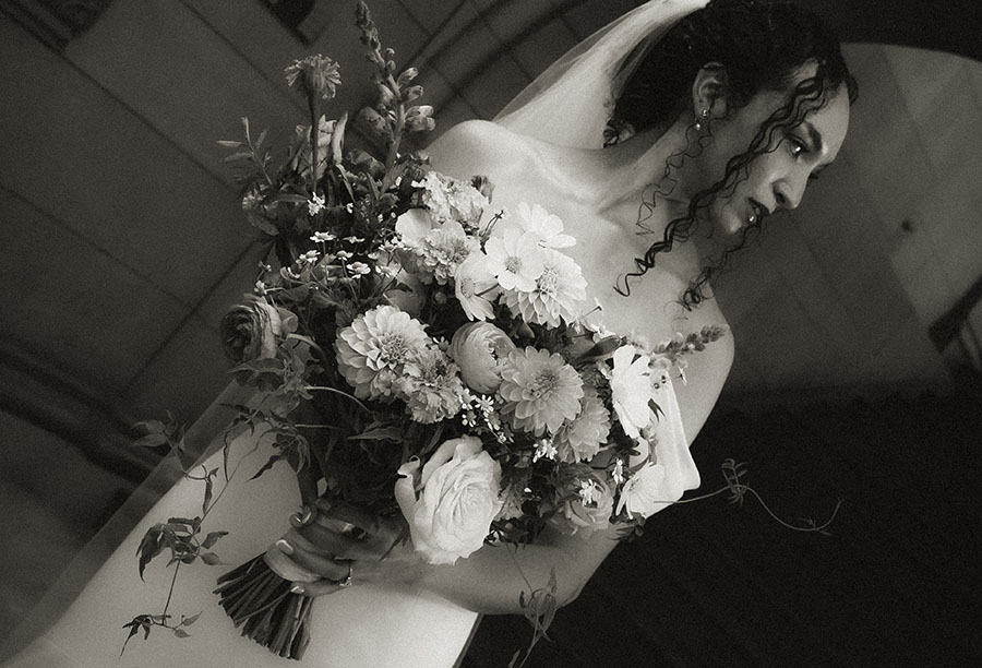 Bride wearing a sleek white gown and long veil in Downtown Pittsburgh during her Intimate Wedding.