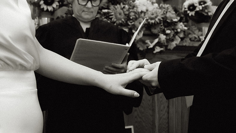 Bride and Groom holding hands during courthouse elopement