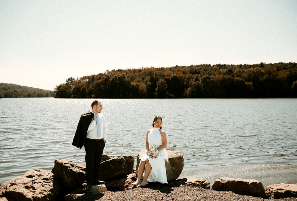 Moraine State Park Bride and Groom Sitting by the water