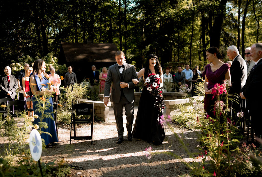 Romantic October wedding ceremony surrounded by fall foliage