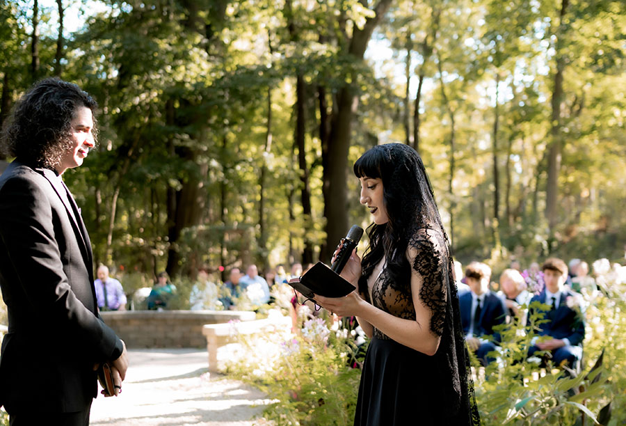 Documentary wedding photographer capturing couple in fall sunlight