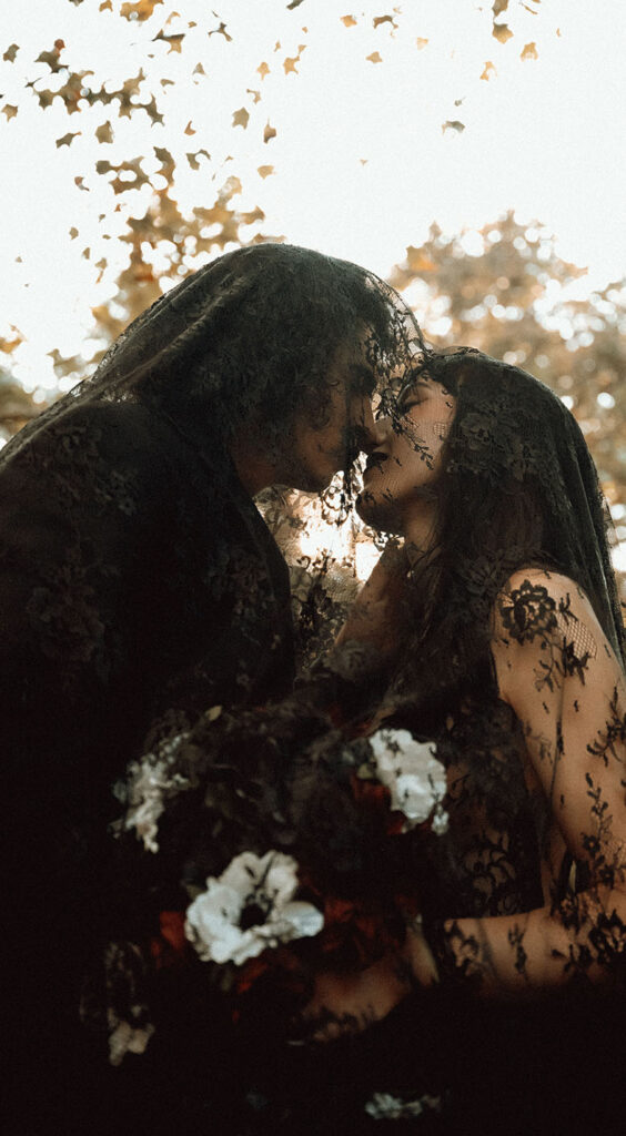 Romantic October wedding ceremony surrounded by fall foliage