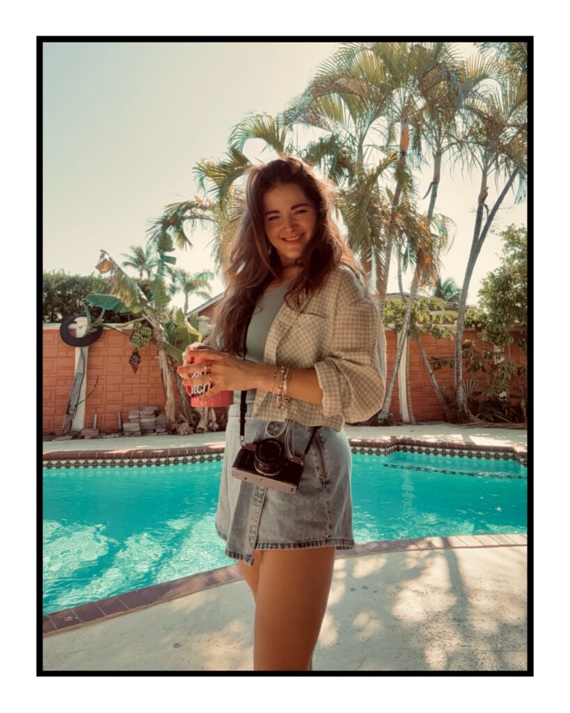 Natalia Baqueiro Documentary Photographer holding a cup of coffee. 