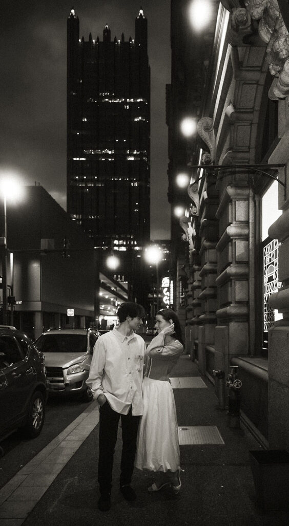 Couple walk happily in Market Square in Pittsburgh