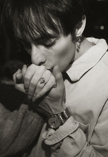 Man kissing her fiance hand showing off engagement ring