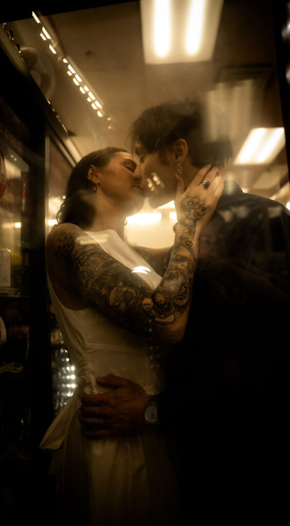 Cinematic photo of a couple inside a brightly lit 7-Eleven during their Lovers Experience.