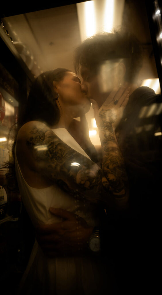 Cinematic photo of a couple inside a brightly lit 7-Eleven during their Lovers Experience.