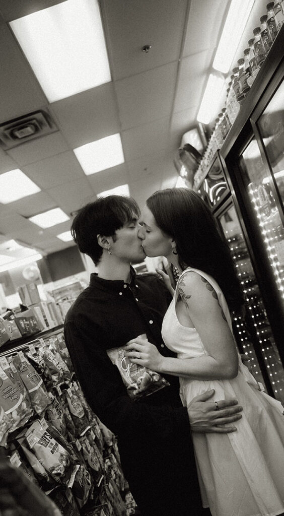 Cinematic photo of a couple inside a brightly lit 7-Eleven during their Lovers Experience.