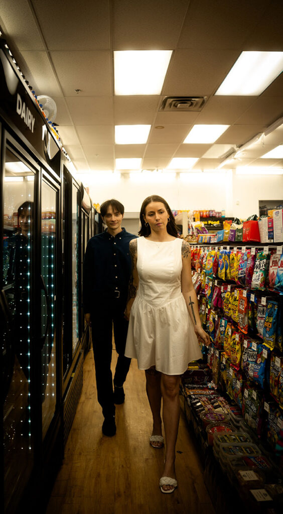 Documentary-style image of a couple holding hands inside 7-Eleven, capturing a nostalgic memory.