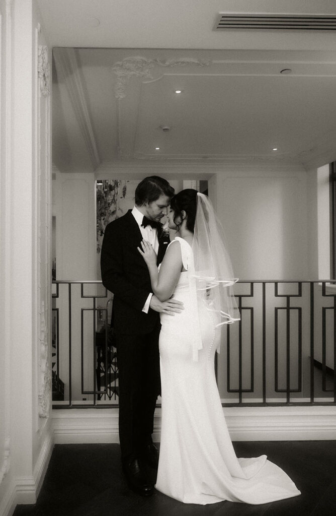 Bride and groom embrace at the Kimpton Hotel Monaco before their courthouse elopement.