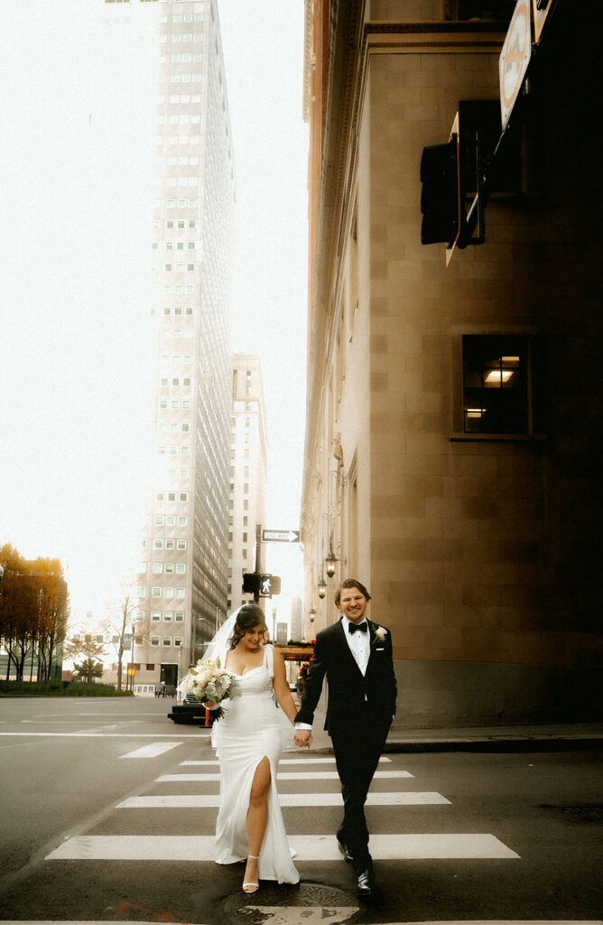 Bride and Groom walking towards their elopement at the Allegheny Courthouse in Downtown Pittsburgh 