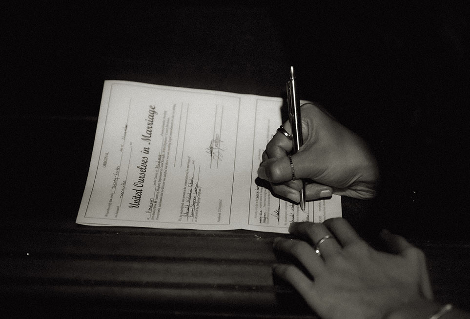 Aida and Zackery signing their Self Uniting Marriage license at the Allegheny Courthouse