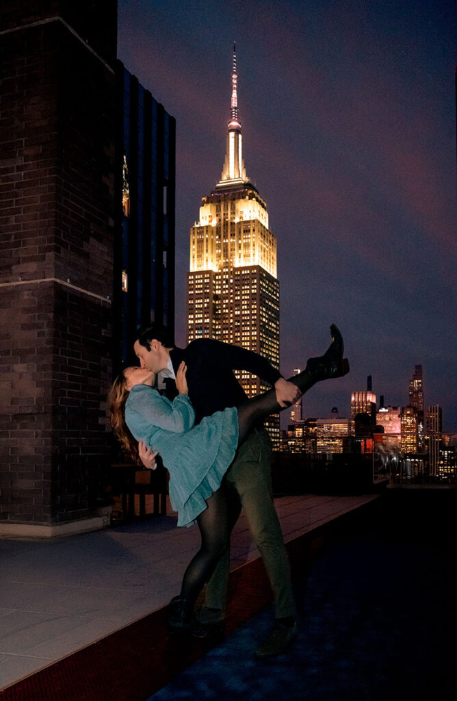 Couple sharing an intimate moment on their apartment rooftop at 10 E 29th Street in New York City during a documentary engagement session.
