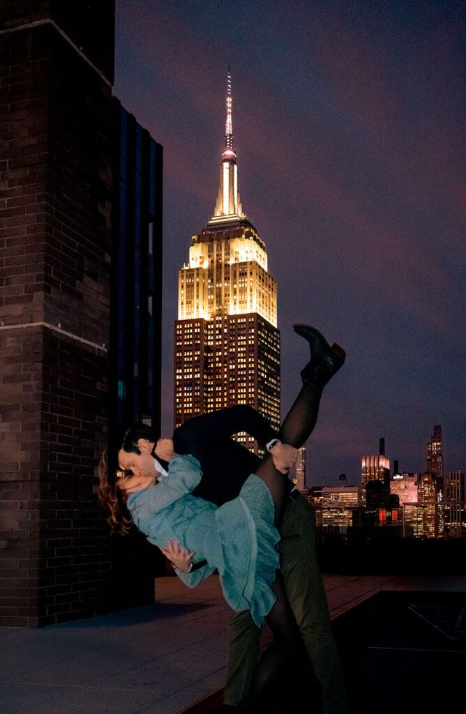 Couple sharing an intimate moment on their apartment rooftop at 10 E 29th Street in New York City during a documentary engagement session.