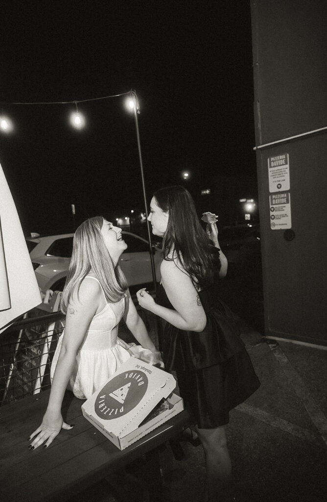 Paparazzi-style couple photo walking through the streets of Downtown Pittsburgh at golden hour
