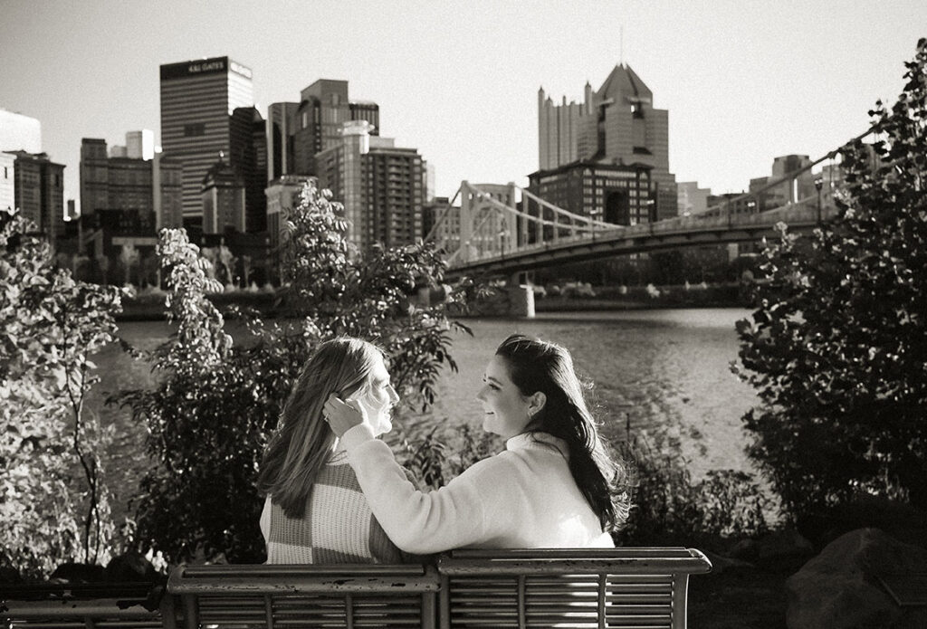 Couple sitting looking at the Pittsburgh Skyline from Downtown