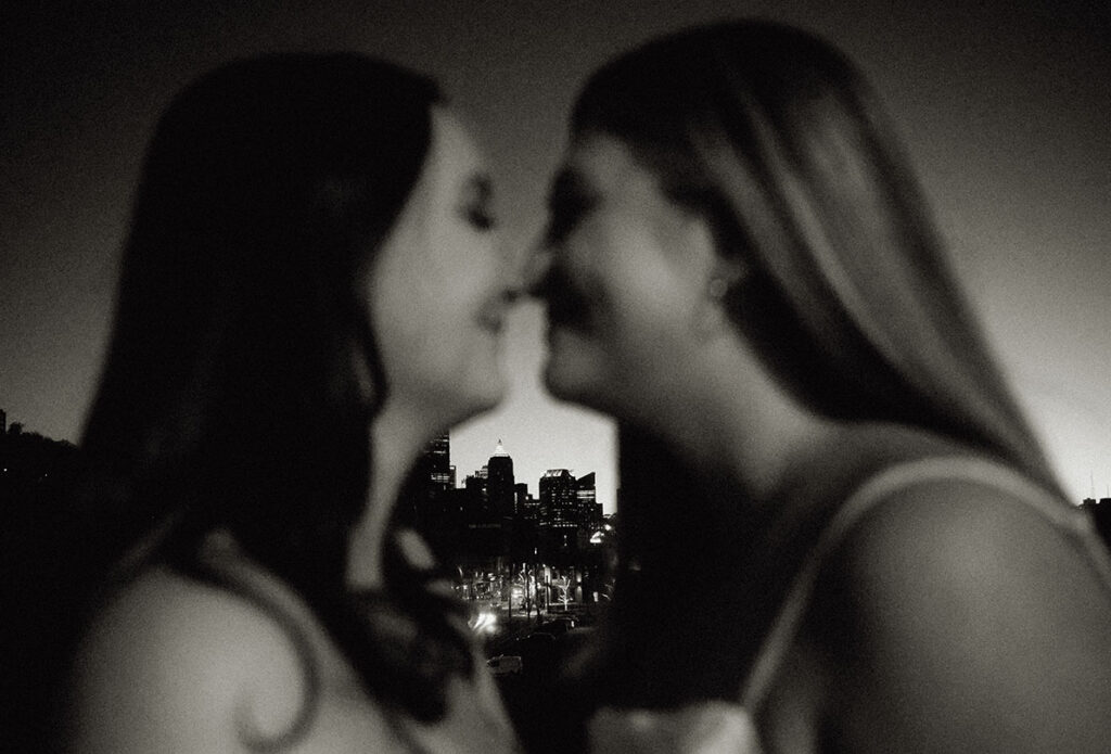 Couple blurred out with Downtown Pittsburgh in the background