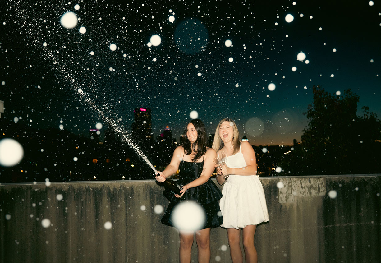 Couple Celebrate at the Strip District Popping a champagne