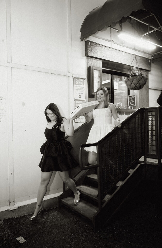 Fun candid photo of couple eating pizza at Pizzeria Davide in the Strip District.