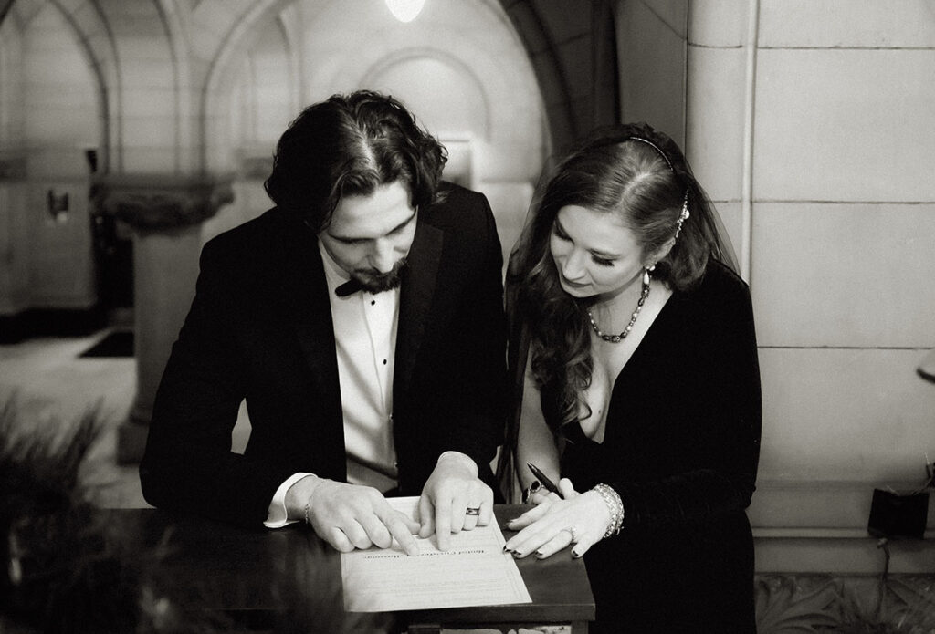 Couple signing marriage certificate at the Allegheny County Courthouse in Downtown Pittsburgh