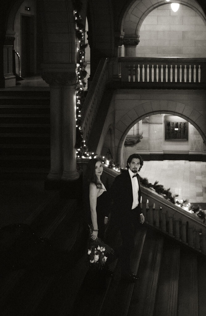 Bride and Groom going down the staircase at Allegheny County Courthouse in Pittsburgh