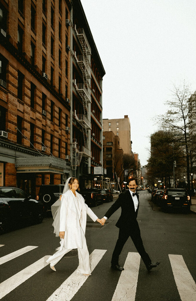 Couple walking through New York City streets during an intimate wedding day