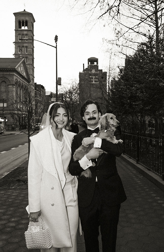 Editorial NYC elopement photos with dog in city streets with cinematic lighting and movement