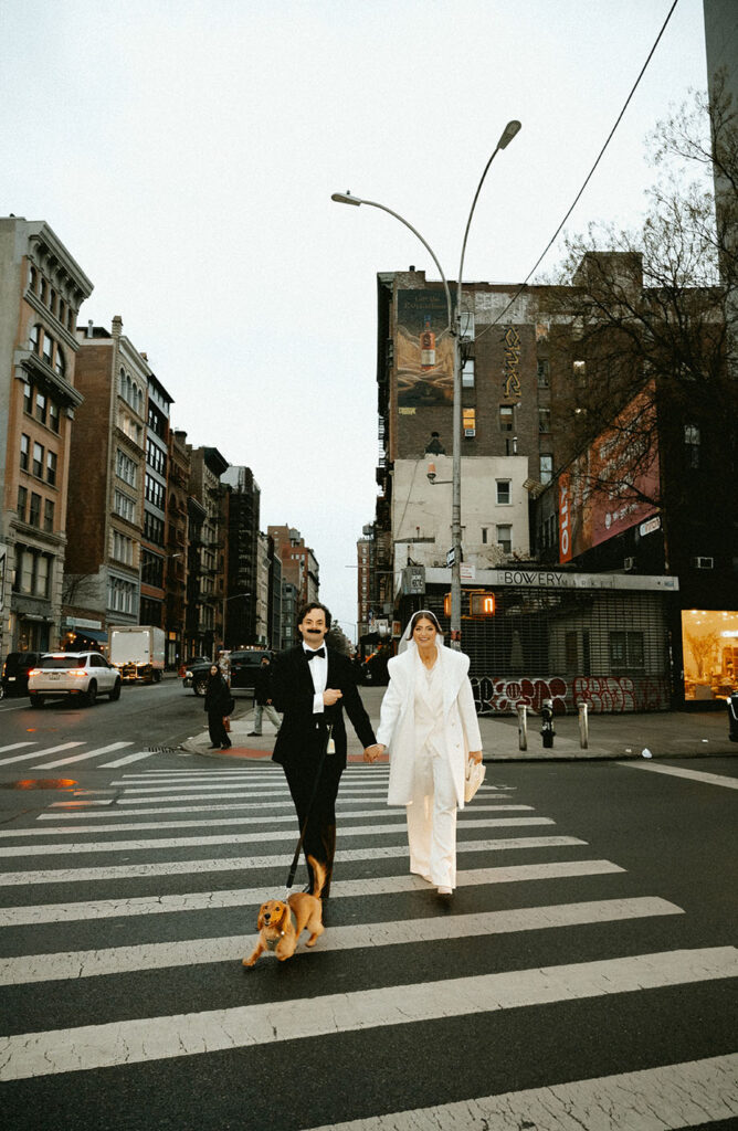 Couple with their dog at Washington Square Park during a New York City elopement