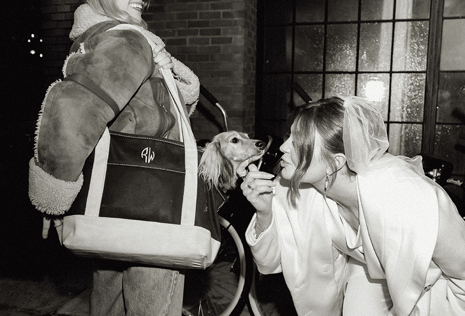 Bride kissing her dog at their intimate wedding in NYC.