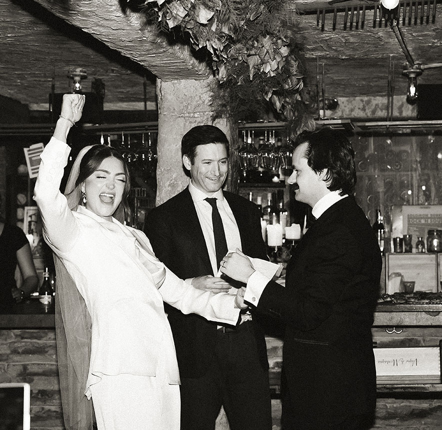 Best friend officiating a candlelit NYC elopement ceremony