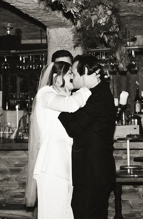 Emotional moments during an intimate wedding in New York City wine cellar