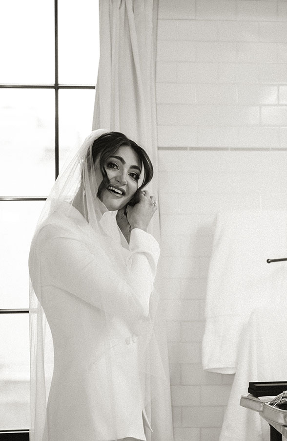 Modern bride wearing a white suit and veil at The Bowery Hotel in New York City