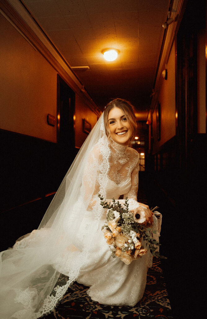 Romantic indoor bridal portrait in historic hotel corridor at Skytop Lodge