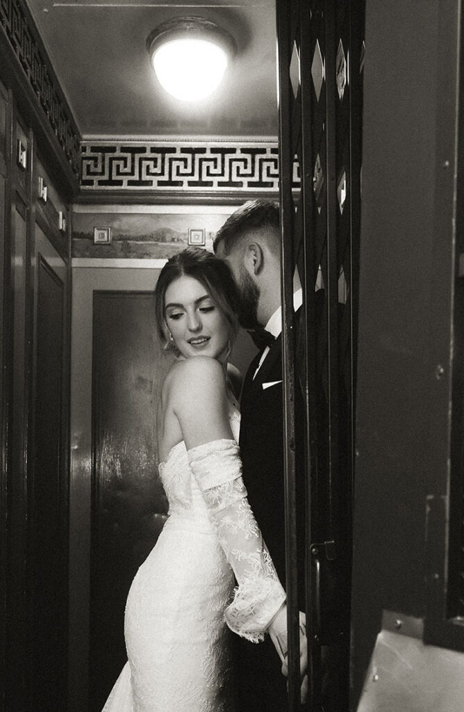 Couple embracing each other in the elevator at the Skytop Lodge in the Pocono Mountains.