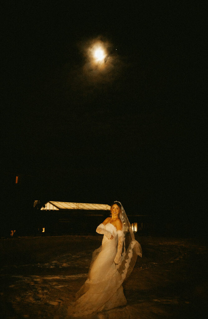 Documentary night portrait of couple under winter moonlight