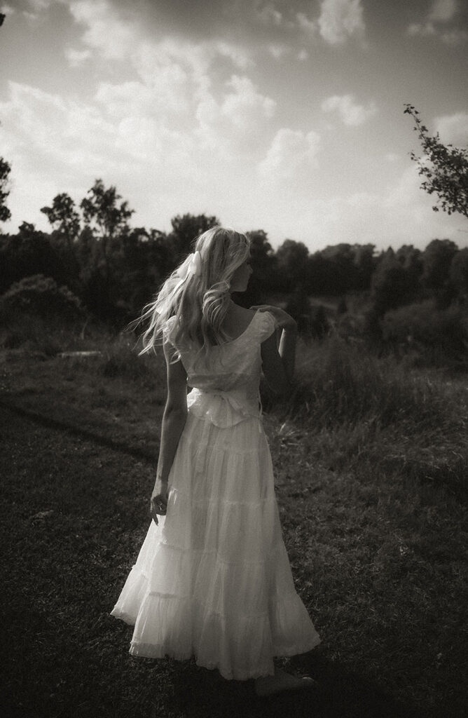 BW White Woman Showcasing her Vintage Dress in Sewickley Park during Summer Engagement.