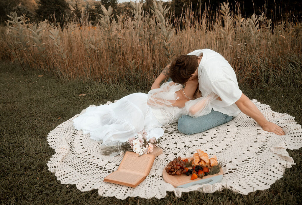 Couple sharing picnic during cinematic Pittsburgh engagement
