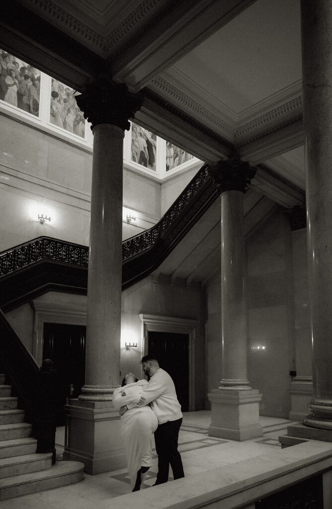 BW Couple Dancing at the Carnegie Museum of Art with the Architectural focus of the museum.