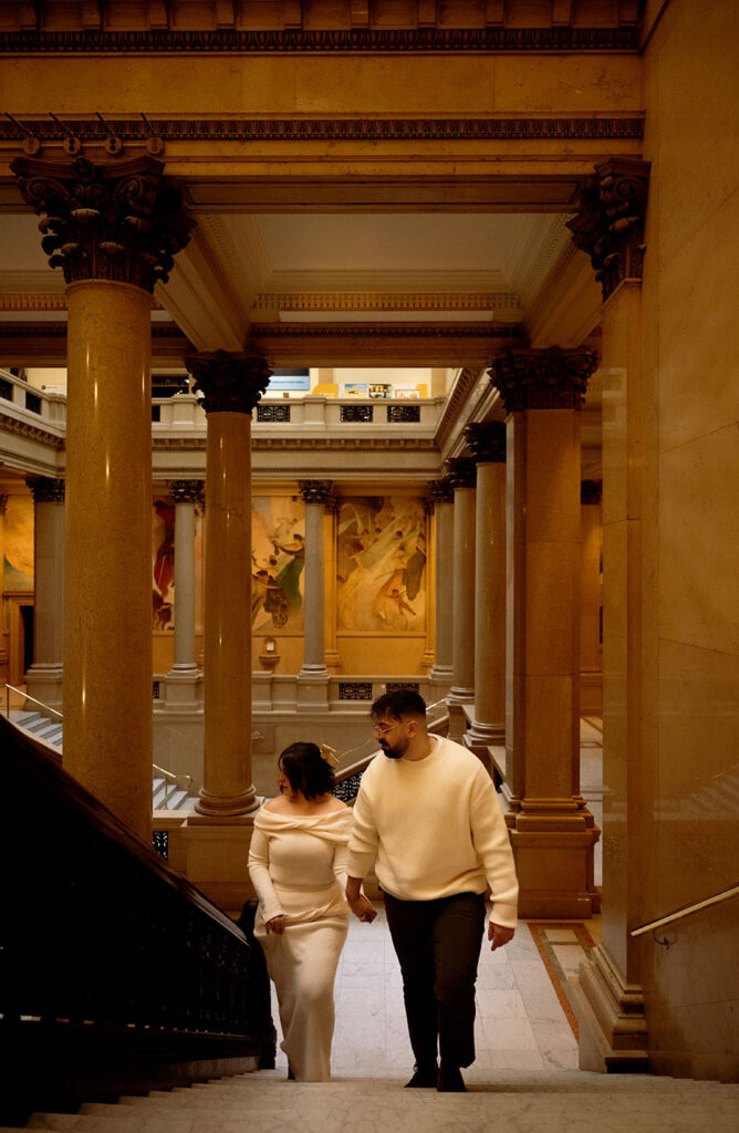 Engagement session at Carnegie Museum of Art featuring couple on textured stone staircase with editorial composition