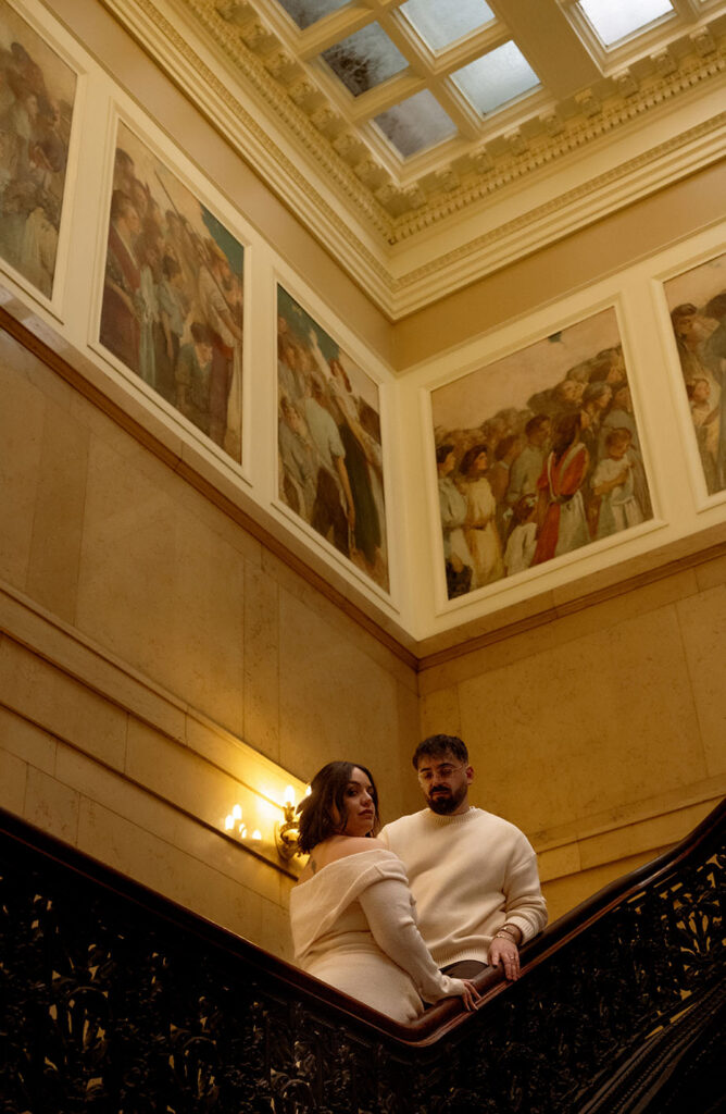 Documentary-style engagement session at Carnegie Museum of Art with couple walking through art gallery space