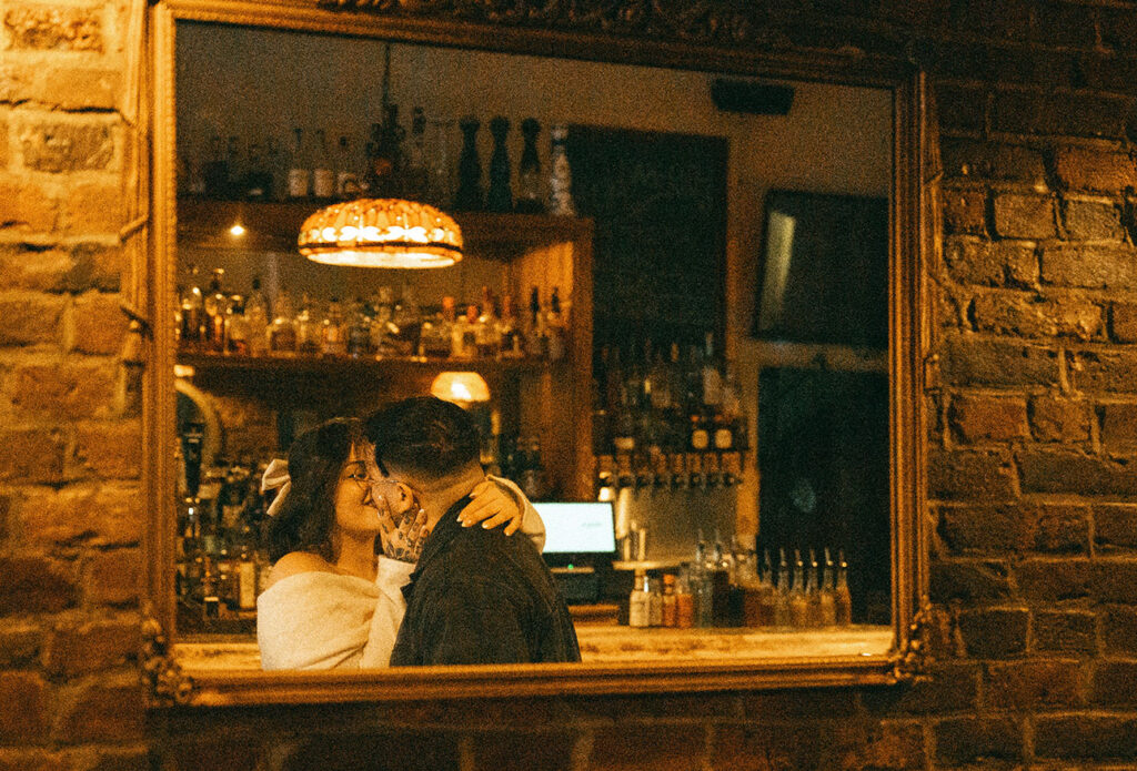 Intimate engagement photos at Acacia speakeasy in Pittsburgh South Side with moody light and romantic atmosphere