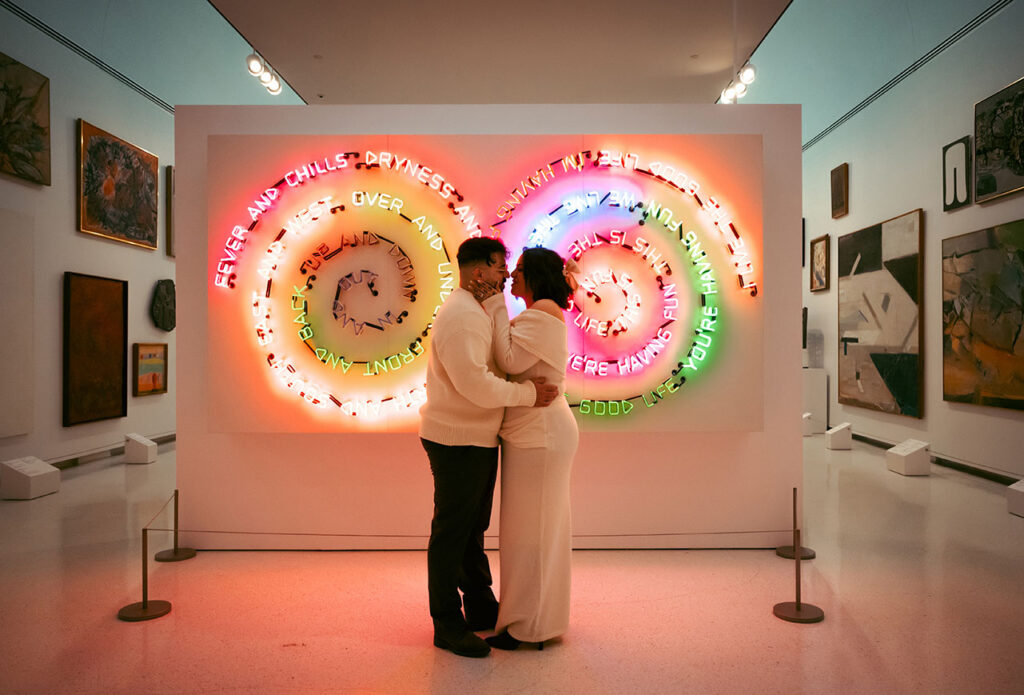 Couple Kiss in front of modern art at Carnegie Museum of Art.