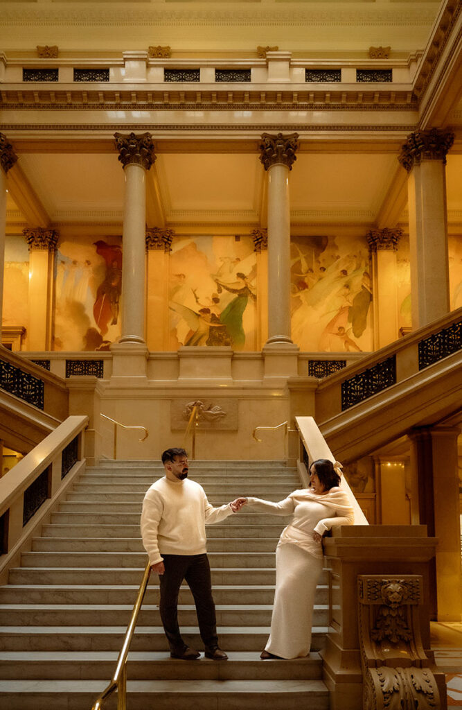 Editorial engagement photo on grand staircase at Carnegie Museum of Art Pittsburgh with dramatic architectural framing